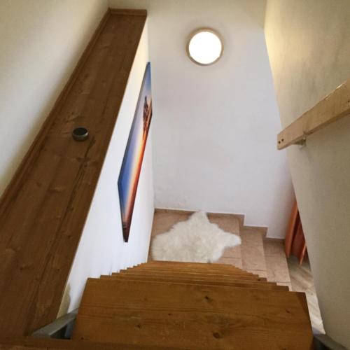 a staircase in a house with a wooden floor at JUDIA in Litomyšl