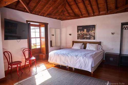 Postel nebo postele na pokoji v ubytování Platanera Suites