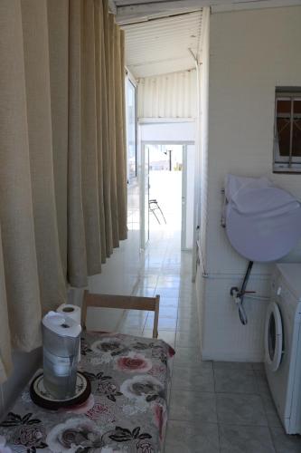 a bathroom with a sink and a washing machine at Beutifull view of batyam in Bat Yam