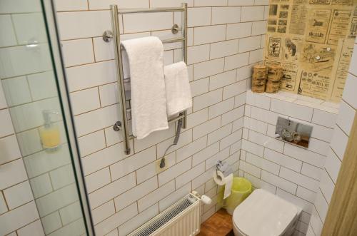 a bathroom with a toilet and a glass shower at Apartment nr. 8 in Odesa
