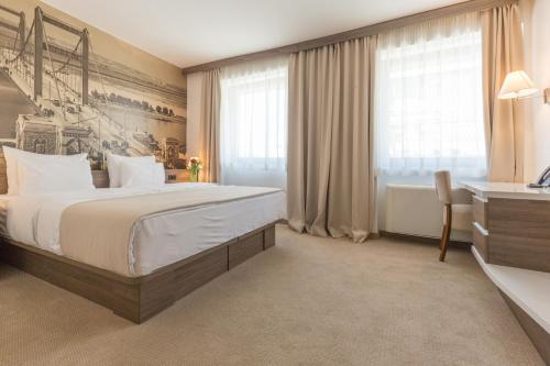 Postel nebo postele na pokoji v ubytování Hotel Royal Inn