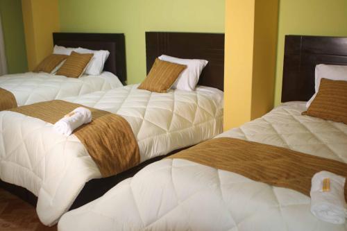 En eller flere senge i et værelse på Residencial el Valle