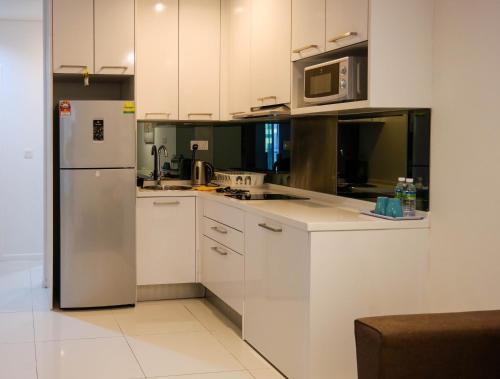 A cozinha ou cozinha compacta de Resort Hostel In City