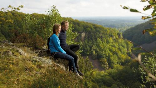 a man and a woman sitting on top of a mountain at Villa Pernilla in Orkelljunga