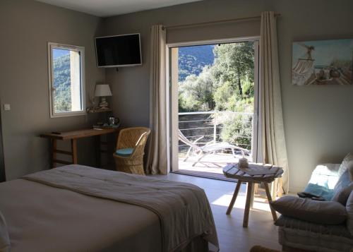 Postel nebo postele na pokoji v ubytování L'oliveraie du Fango