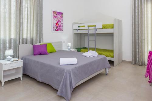 Postel nebo postele na pokoji v ubytování Paloma B&B