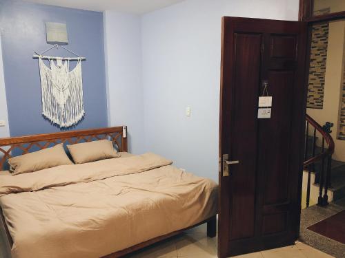 Postel nebo postele na pokoji v ubytování Cactus Homestay