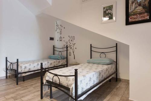 Llit o llits en una habitació de Villa Ginevra