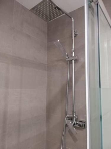 a bathroom with a shower with a glass door at Apartamento 315 en paseo marítimo 96 in Fuengirola