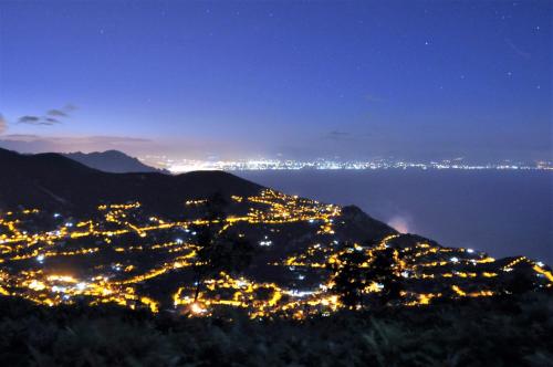 a view of a city lit up at night at Valle degli Dei in Agerola