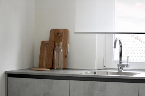 a kitchen counter with a sink and a window at Fortuna's quiet place in Riva del Garda