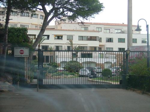a black fence with a building in the background at Cap Sa Sal Navy, Begur, Girona in Begur