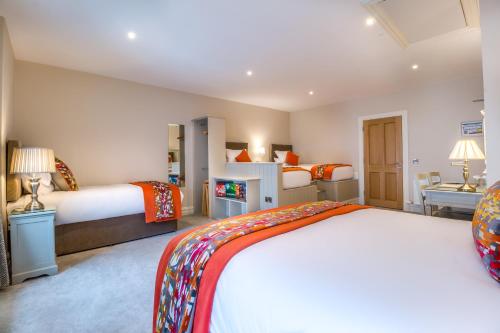 a hotel room with two beds and a bedroom at Kingston's Townhouse in Killorglin