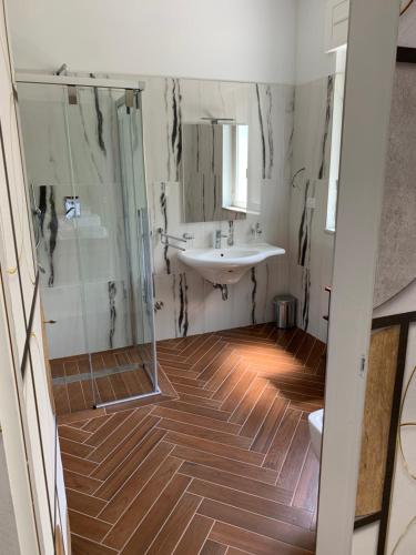 a bathroom with a sink and a shower at La Villetta B&B in Scisciano