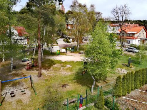 an aerial view of a park with a playground at Rubin in Mrzeżyno