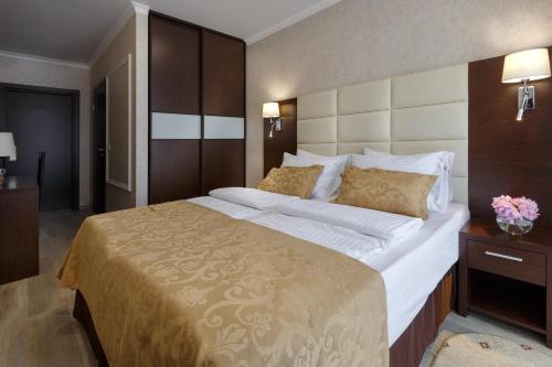 a bedroom with a large bed in a room at Hotel Marine Palace in Gelendzhik