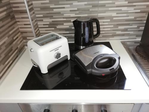 a coffee maker and a blender on a counter at TERRA LEMNIA in Moudhros