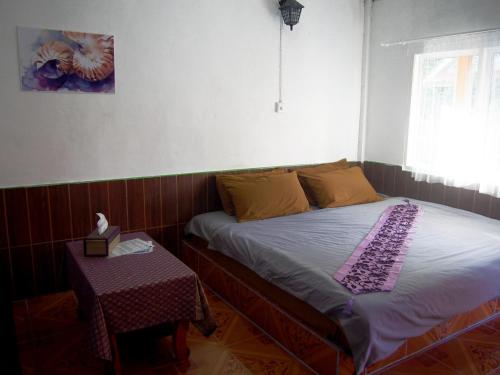 Postel nebo postele na pokoji v ubytování Coco Beach Bungalows