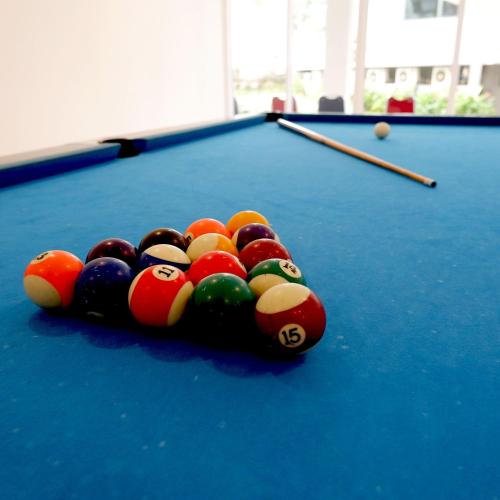 a heap of billiard balls on a pool table at Nemuru Grand Bhuvana Ciawi in Bogor