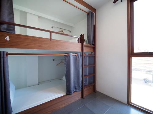 Cama o camas de una habitación en WEE HOSTEL