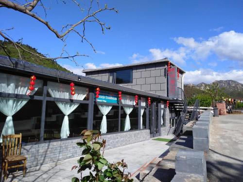Imagen de la galería de Beijing Huanghuacheng Water Great Wall Derunju Guesthouse, en Huairou