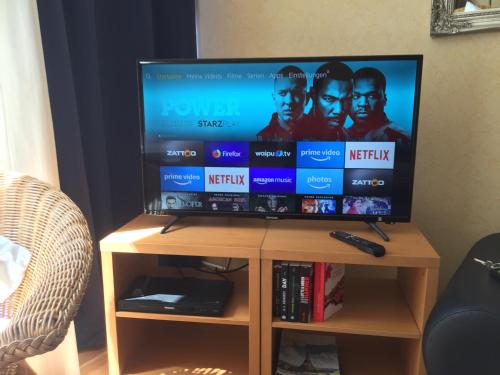 TV a/nebo společenská místnost v ubytování Perfectly Downtown / Mitten im Geschehen