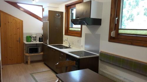 a kitchen with a sink and a counter top at Haus Frank Pitztal in Sankt Leonhard im Pitztal