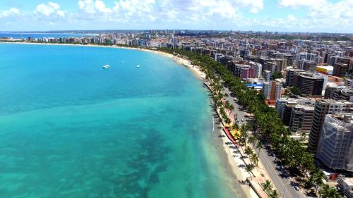 an aerial view of a beach and the ocean at Pousada Catamarã Praia de Pajuçara in Maceió