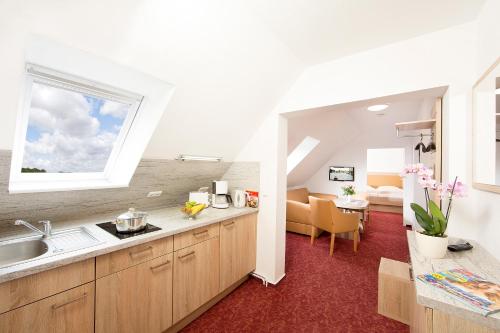 Kuchyň nebo kuchyňský kout v ubytování Ferienhotel Bernstein