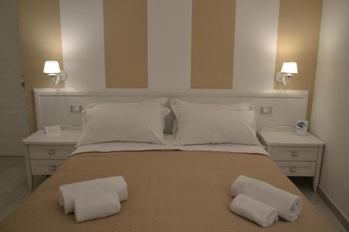 a large bed with two pillows on top of it at Cuore di Vieste in Vieste