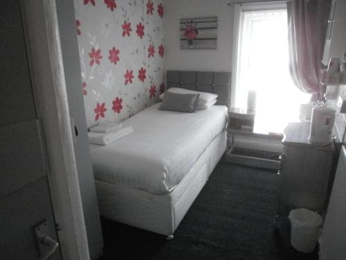 Ένα ή περισσότερα κρεβάτια σε δωμάτιο στο The Withnell Hotel