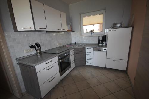 Kuchyň nebo kuchyňský kout v ubytování Lotsenhaus