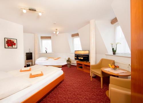 Postel nebo postele na pokoji v ubytování Ferienhotel Bernstein