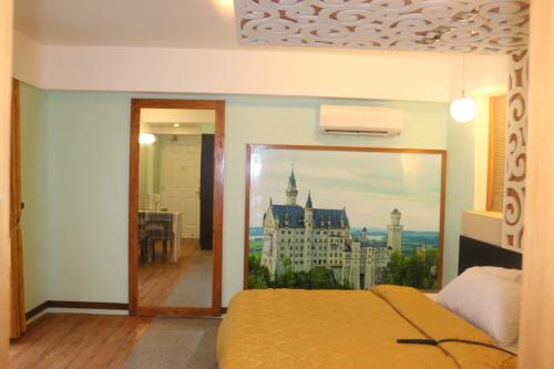 a bedroom with a bed and a view of a building at Eurotel Boracay in Boracay