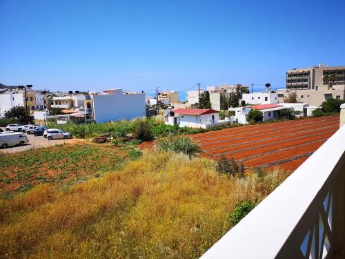 a view of a city from a balcony at Katerina Apartments in Stalís