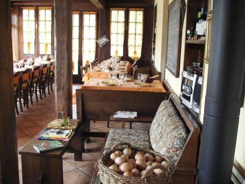 a large dining room with a long table and chairs at Fattoria Delle Rose in Salussola