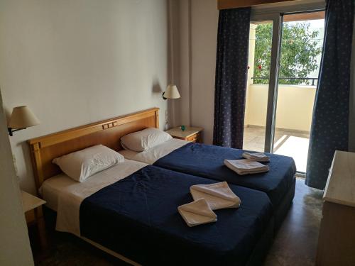Postel nebo postele na pokoji v ubytování Tondoris Apartments