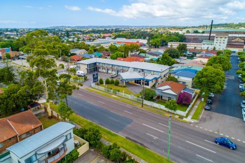 an aerial view of a town with a street at Citigate Motel Newcastle in Newcastle