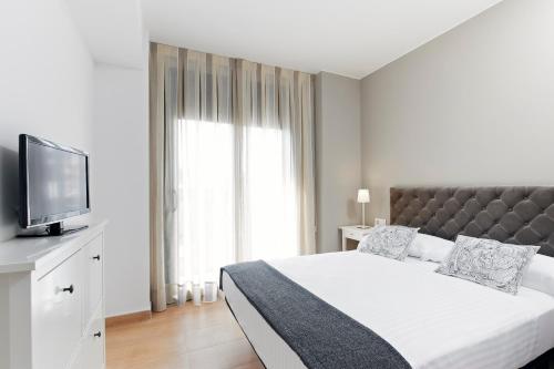 Posteľ alebo postele v izbe v ubytovaní Barcelona Apartment Gran de Gràcia