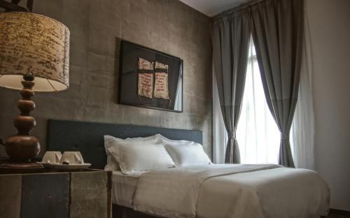 Ліжко або ліжка в номері Merton Hotel Ipoh