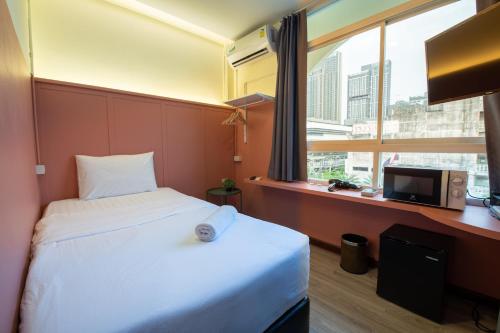 Ένα ή περισσότερα κρεβάτια σε δωμάτιο στο Spacy BKK