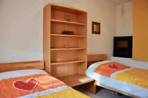 Кровать или кровати в номере Familien Appartement „Im Landhaus“