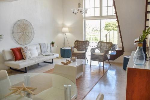 a living room with a couch and a table at Suites at Coral Resorts in Miami