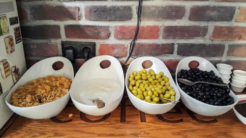 a group of bowls of food sitting on a table at Grand Esen Hotel in Istanbul