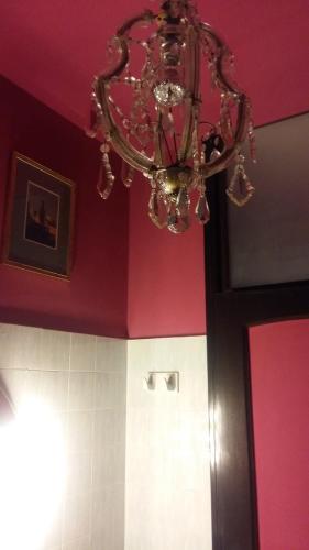 a chandelier hanging from the ceiling in a bathroom at La Martino B&B in Varese