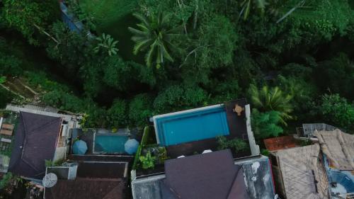 an aerial view of a resort with trees at River Sakti Ubud by Prasi in Ubud