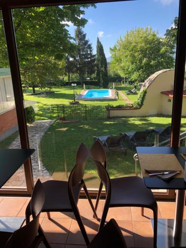 a patio with chairs and a view of a pool at Villa La Rena in Anagni