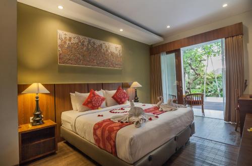 Postel nebo postele na pokoji v ubytování River Sakti Ubud by Prasi