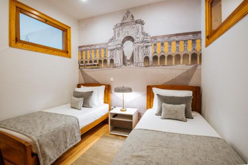 Postel nebo postele na pokoji v ubytování Varandas de Lisboa - Tejo River Apartments & Rooms