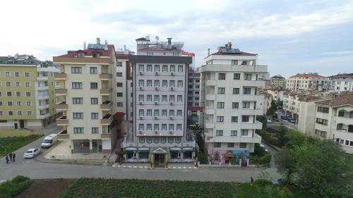 a large building in a city with many buildings at Sogutpark Hotel in Trabzon